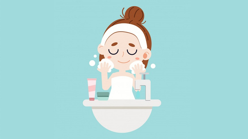 a girl washes her face after makeup